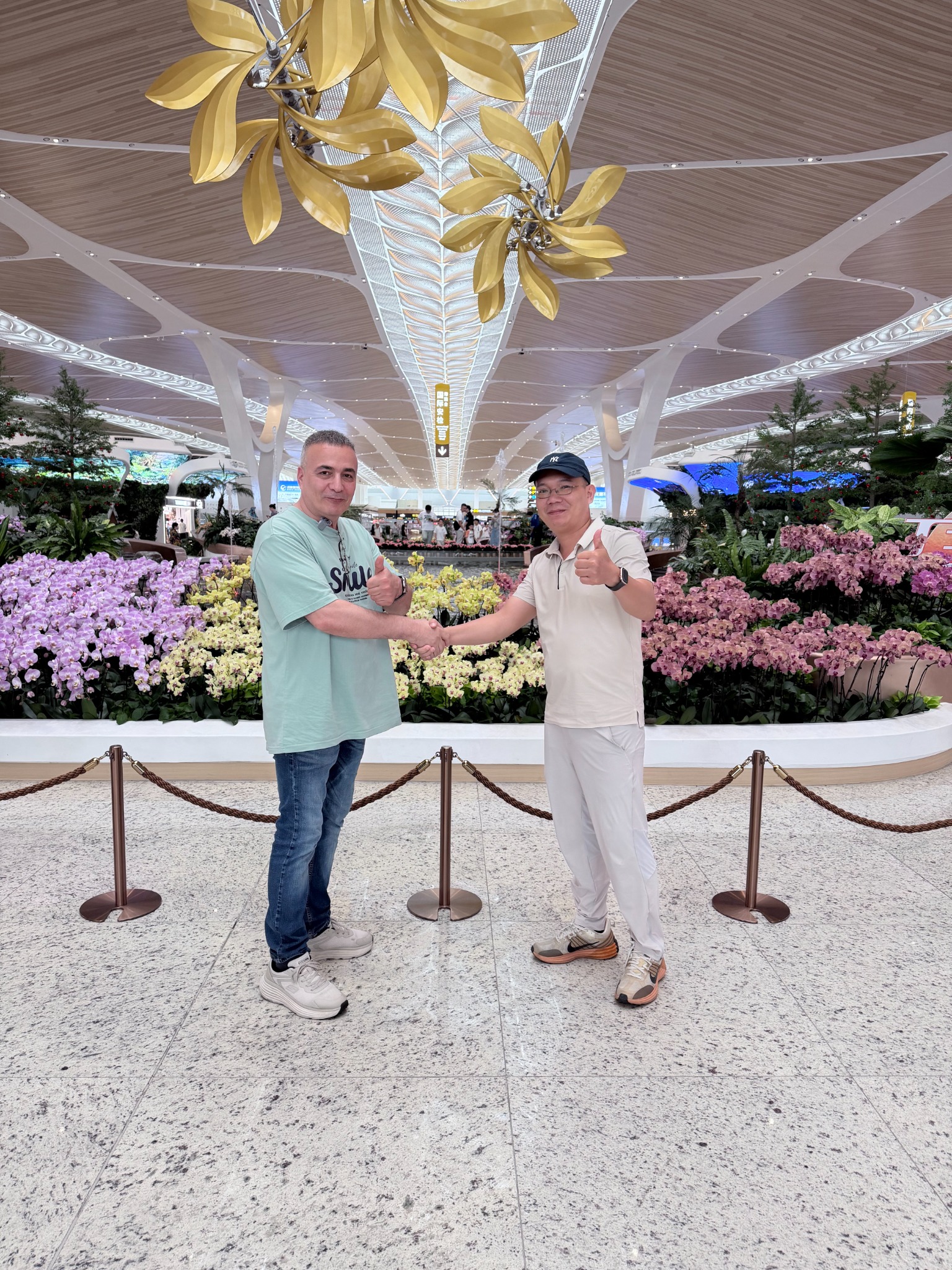 Two people during an on-site visit to a flower display